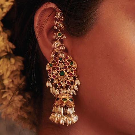 Embodying grace and sophistication in every detail are our exquisite 22K gold embossed drops. Featuring delicate peacock motif jadau designs, these drops are paired with fine rows of valanda, ruby, and emerald ear chains. WhatsApp 9964641869 for enquiries. 📍Visit the Blue CKC&Co. Flagship store , near Safina Plaza. Look for the DIAMOND logo! Featuring: @ciashetty Saree: @aikyatha Carpet: @carpetkingdomindia Hair and Makeup: @makeupbyshwethamahadev #CKCCo #JewelleryLovers #InstaJewellery ... Diamond Jhumkas Indian, Diamond Chandbali Earrings, Gold Ear Jewelry, Indian Gold Jewellery, High Jewelry Design, Fashion Jewelry Necklaces Gold, Peacock Motif, Antique Necklaces Design, New Gold Jewellery Designs