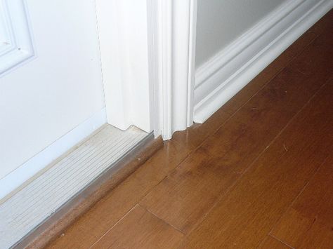 Quarter Round Door Frame, Baseboard Step Down Transition, Modern Quarter Round Trim Baseboards, Quarter Round Trim Baseboards, Baseboards Rounded Corners, Quarter Round Trim Baseboards Door, T Molding Floor Transition, Carpenter Tricks, Door Saddle