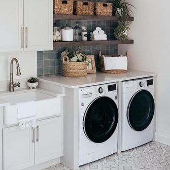 10 Laundry Room Designs That You'll Be Obsessed With Laundry Room White Cabinets, Cottage Laundry Room, Pull Out Ironing Board, Diy Laundry Room Makeover, Laundry Room Designs, Gray Shiplap, Laundry Room Hacks, Hidden Laundry, Narrow Shelves