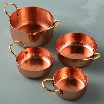 The Best Copper Pans, Pots, and Kitchen Tools to Own Right Now Gold Measuring Cups, Copper Measuring Cups, Non Toxic Cookware, Royal Kitchen, Copper Utensils, Copper Handles, Woodworking Furniture Plans, Copper Cookware, Copper Pans