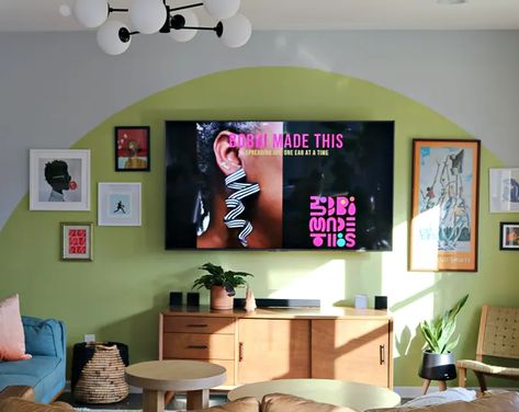 This Easy "One and Done" Method Is a Stylish Way to Hide Your TV | Apartment Therapy Color Blocking Living Room Walls, Tv Wall Design Colorful, Painted Arch Behind Tv, Painted Arch Living Room, Colorful Living Room Paint Ideas, Colorful Tv Room, Mural Behind Tv, Living Room Tv Wall Paint Ideas, Green Painted Walls Living Room