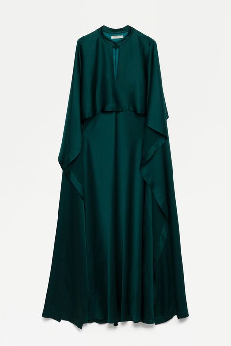 HOLIDAY 2023 READY-TO-WEAR The Amory Dress in Emerald. ﻿Silken cape, cascading in luxurious flow. The epitome of elegant drape and alluring form. Elegant Modest Dresses Gowns, Satin Cape Dress, Elegant Abayas Luxury, Satin Abaya Designs, Satin Dresss, Flowing Outfits, Modest Satin Dress, Emerald Satin Dress, Modest Fashion Aesthetic