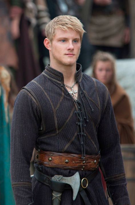 Björn Ironside is the eldest son of Ragnar Lothbrok and Lagertha. He is the third husband of Torvi and heir of Kattegat. Loyal and emulating his wise father, Björn had made a name for himself, following in his father's footsteps as a formidable warrior, leader, and explorer. He shares his father's thirst for adventure and wishes to explore faraway lands. Upon turning 12 and coming of age in Viking society, Björn received his arm ring from the then reigning Earl Haraldson. Björn had ye... Vikings Tv Show Costumes, Heathen Wedding, Fantasy Attire, Bjorn Vikings, Peasant Boy, Ragnar Vikings, Fair Costume, Costume Viking, Male Aesthetic