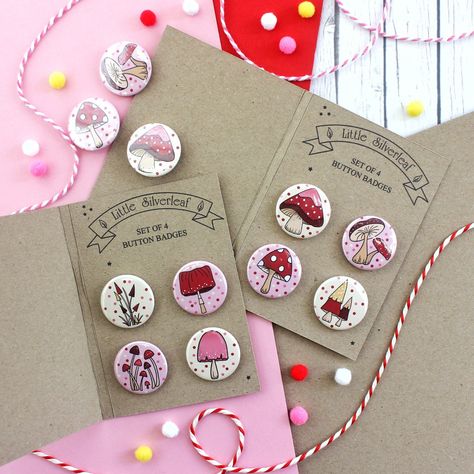 Perfectly cute little fairytale magical mushroom button badges to pin to your outfit, gift as party favours, pin to pennants, or add to your collection! These small badges are all 25mm in size, and feature a safety pin-back. They come securely packaged in a set of four on a protective backing card (made of recycled card) to ensure they arrive with you safely. Handmade in Scotland, this cute little button badge set is perfect to pin to your jacket, to add to your bag for a cute seasonal touch, or to bring a little flair to a camera strap! * Please note, these badges are not suitable for very young children due to sharp points and small parts. * Looking for more fairytale magical mushroom goodies? Click the links below to see my magical mushroom themed items: Wooden Pin Badge - https://www.e Pin Button Design, Store Inspiration, Magical Mushroom, Pin Button Badges, Pin Ideas, Button Badges, Backing Card, Letterbox Gifts, Product Ideas