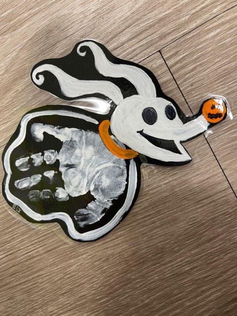 Infant Caterpillar Crafts, Spooky Handprint Art, Halloween Art Projects For Infants, Nightmare Before Christmas Footprint Art, Toddler Halloween Art Projects, Nightmare Before Christmas Handprint Art, Disney Halloween Activities, Halloween Toddler Painting, Handprint Halloween Crafts For Toddlers