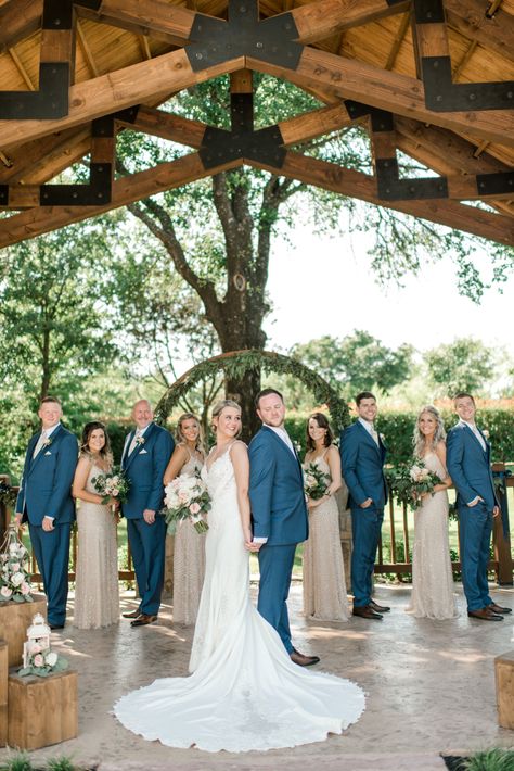 Navy And Champagne Wedding Colors Bridesmaid Dress, Wedding Navy Suits Bridal Parties, Fall Wedding With Navy Suits, Navy Tan And Pink Wedding, Navy Blue Tux Wedding Color Palettes, Tan Bridesmaid Dresses Navy Suits, Colors That Go With Navy Blue Wedding, Blue Suit Bridal Party, Outdoor Wedding Bridal Party