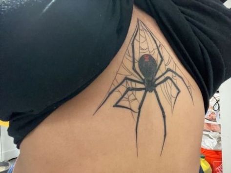 Chest Spider Tattoo Female, Spider Spine Tattoos For Women, Spider Tattoo With Number, Spider Ribcage Tattoo, Spider On Back Tattoo, Black Widow Stomach Tattoo, Spider Tattoo Sternum, Maneater Tattoo Ideas, Spider Stomach Tattoos Women