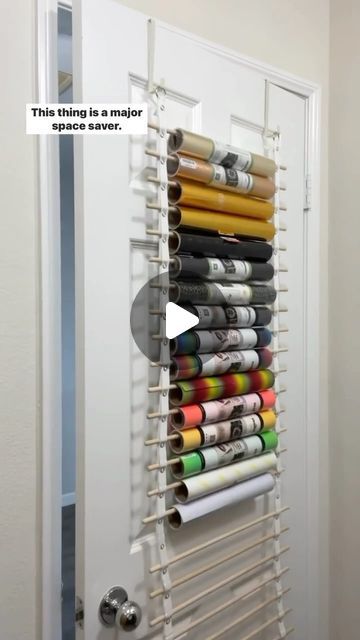 Megan Meketa • Crafting Tutorials on Instagram: "Let’s chat vinyl storage!! 📦💕 This is the craft room vinyl organizer from my friend Renee, @crafterscreek!! It can hold 25 rolls of vinyl and transfer tape and can be hung on the back of a door or on a wall. Major space saver!! It’s the perfect way for me to store my @teckwrapcraft vinyl rolls and transfer tape!! 👌✨ #craftstagram #happycrafting #ilovecrafting #lovecrafting #lovetocraft #craftlover #craftsupplies #craftingcommunity #craftstorage #craftingtools #crafttools #vinylstorage #craftroomorganization #smallcraftbusiness #craftroomstorage #cricut #heattransfervinyl #htvvinyl #teckwrapcraft" Vinyl Rolls Storage Ideas, Storage For Cricut Vinyl, Ways To Store Cricut Vinyl, Storage For Vinyl Rolls Diy, How To Organize Vinyl Rolls, Diy Vinyl Roll Holder, Circuit Vinyl Storage, Ways To Store Vinyl Rolls, Storing Vinyl Rolls