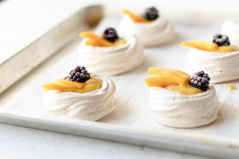 Mini Pavlovas with Lemon Mango Curd Lemon Pavlova, Mango Curd, Mini Pavlovas, Orange Curd, Mini Pavlova, Yummy Deserts, Sensory Overload, Cake Board, Pavlova