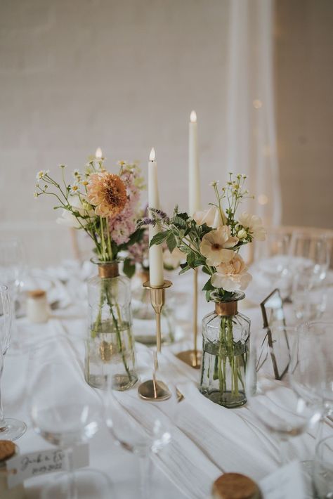 Simple Color Schemes Wedding, Wildflower Wedding Circle Table, Round Wedding Table Inspiration, Colorful Vases Centerpiece, Circle Tables With Bud Vases, Candlestick And Bud Vase Centerpiece, Taper Candles And Bud Vases Wedding, April Wedding Flowers Centerpieces, Wedding Table Taper Candles