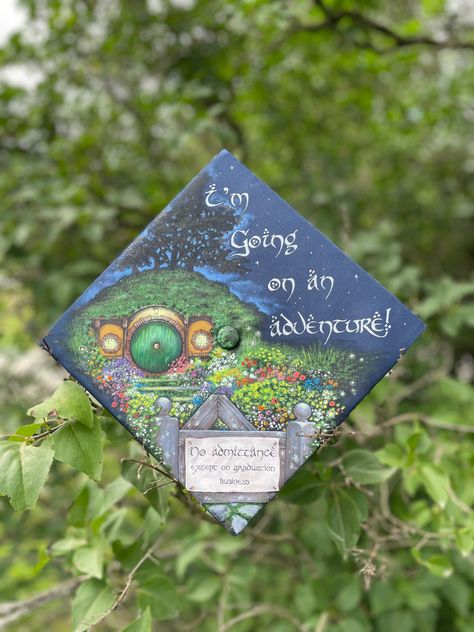 I’m going on an adventure! Graduation cap. Painted by Costanzo. Hozier Graduation Cap, English Graduation Cap, Lotr Graduation Cap, Painted Grad Cap, Lord Of The Rings Graduation Cap, Graduation Painting, Graduation Cap Painting, Earthy Graduation Cap, Painted Graduation Cap