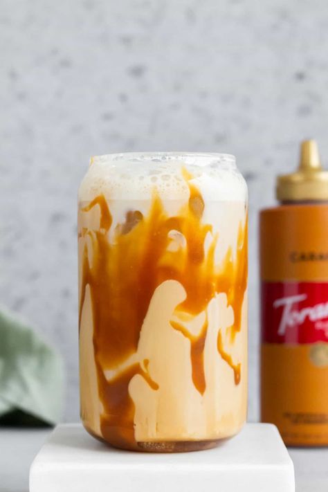 For a refreshing iced coffee, try this homemade iced caramel latte! It's sweet, creamy, and rich. All you need are four simple ingredients to make this coffee shop style iced coffee at home. Food Moodboard, Iced Caramel Latte, Iced Coffee At Home, Ice Milk, Caramel Latte, Coffee At Home, Caramel Coffee, Vanilla Syrup, Decaf Coffee