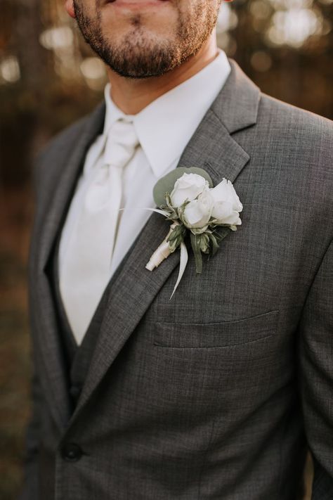 Such a classic wedding look for this groom! Gray suit with a crisp white shirt and tie & white roses for his bout. Florals by @sainteterre Photo by Christi Martin Photography Men Grey Tuxedo Wedding, Wedding Suit Light Grey, Grey Suit Boutonniere, Heather Grey Suit Wedding, Groom In Grey Suit, Wedding Groom Suit Grey, Rose Buttonholes Wedding, Gray Wedding Suit For Groom, Grey Suits For Men Wedding