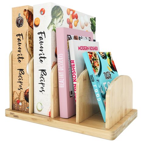 PRICES MAY VARY. CONVENIENT KITCHEN COMPANION - The bamboo kitchen countertop cook book organizer features four 2.36'' slots, providing ample space to store your cookbooks, recipe cards, recipe binders & other essentials. With this desktop bookshelf, you can keep everything within reach, saving valuable countertop space and making cooking more efficient. Beautiful bamboo aesthetic combined with a practical overall design makes our mini bookshelf the perfect kitchen companion. EASY ASSEMBLY & SPA Kitchen Cookbook Shelf, Recipe Book Holder, Cookbook Organization, Cookbook Storage, Recipe Book Holders, Cookbook Shelf, Mini Bookshelf, Book Organizer, Book Holder Stand