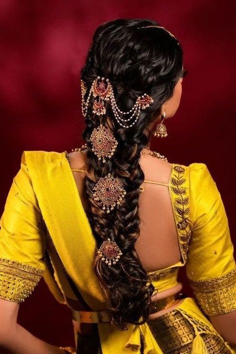 One of the most unique characters of a South Indian bride is her hairstyle. Not only does it enhance the look of the bride but it’s an instant eye-catcher. From simple braids to floral buns we share them with you. South Indian Bride Braid Hairstyle, Simple South Indian Bride Hairstyle, Traditional South Indian Bride Hairstyle, Hair Assories For Wedding Indian, South Indian Braid Hairstyles, Nami Hairstyles, Traditional Braids Hairstyles Indian, South Indian Bride Hairstyle Muhurtham, Messy Braid Indian Wedding