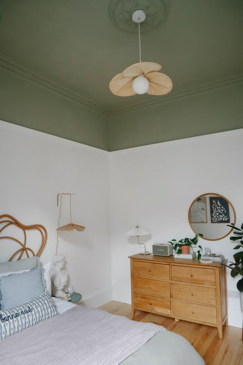 Our Guest Bedroom Makeover – AD. Olive Green Ceiling, Bedroom Green Feature Wall, Olive Green Accent Wall Bedroom, Bedroom In Green, Olive Green Rooms, Woven Headboard, Green And White Bedroom, Stained Dresser, Green Ceiling