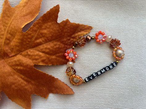 Embrace the beauty of autumn year-round with our Evermore Autumn-Inspired Friendship Bracelets! 🍂🧡🍁 Handcrafted with love, these bracelets capture fall's vibrant hues – from the golden yellows to fiery oranges and deep reds. 🍂🍂 Perfect for celebrating the changing seasons or sharing with a friend. Fall Embroidery Bracelets, Fall Inspired Bracelets, Orange Eras Tour Bracelet, Autumn Friendship Bracelet, Fall Themed Bracelets, Bracelet Fall Leave Bracelet, Orange Bracelet, Changing Seasons, Fall Season