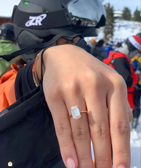 Photo of a 3.5 carat emerald cut natural diamond set in a yellow gold thin band solitaire.  Shown on hand of a snowboarder white black helmet and goggles. Northstar ski resort in background. Emerald Cut Diamond Engagement Rings, Love Rings, Dream Wedding Ring, Tag Your Love, Timeless Engagement Ring, Get Engaged, Emerald Cut Diamond Engagement, Cute Engagement Rings, Emerald Cut Diamond Ring