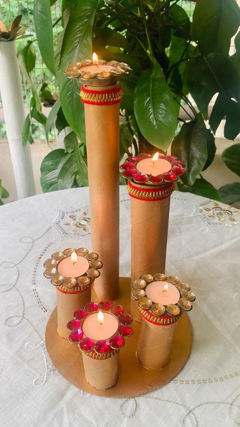 Difficulty: Easy     DIY CANDLE STAND PREPARED BY TOILET PAPER & KITCHEN PAPER CARDBOARD STAND & I have also used cake base cardboard which we get with every cake AS A BASE FOR CANDLE STAND ……..  • :  • 💥U just need golden colour choice is totally yours either u can use spray paint or acrylics…  • 💥I have used lace to give it a festive look….  • :  • :  :  Use it all whatever way u like and your FESTIVE CANDLE STAND IS READY …….  • :  • :  • So why are you waiting , let’s start getting ready for festivities …..  • :  • :  • 📌IF U LIKE THE IDEA SHARE AND SAVE IT FOR REFERENCE   • AND STAY TUNED FOR MORE FESTIVE DIY WITH ME @magic_of_green Diy Candle Stand, Candle Stand Diy, Cardboard Stand, Diwali Activities, Paper Kitchen, Janmashtami Decoration, Diwali Decoration Items, Diwali Decorations At Home, Cake Base