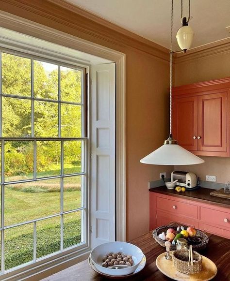 Edward Bulmer Natural Paint on Instagram: "This kitchen has been transformed by @charlottecroftsandco, gone are the unwelcoming cold greys and hello to warm and inviting Mediterranean pinks and terracotta reds.⁠ ⁠ @charlottecroftsandco chose to use our 'Jonquil' on the walls paired perfectly with 'Red Ochre' on the cabinets and with the most gorgeous light from the large window, with a touch of 'Sky Blue' on the shutters to contrast. ⁠ ⁠ A marvellous use of colour! 🎨" Ochre Kitchen, Heritage Paint Colours, Firing Clay, Larder Storage, Edward Bulmer, Heritage Paint, Cupboard Paint, Kitchen Cupboards Paint, Natural Paint