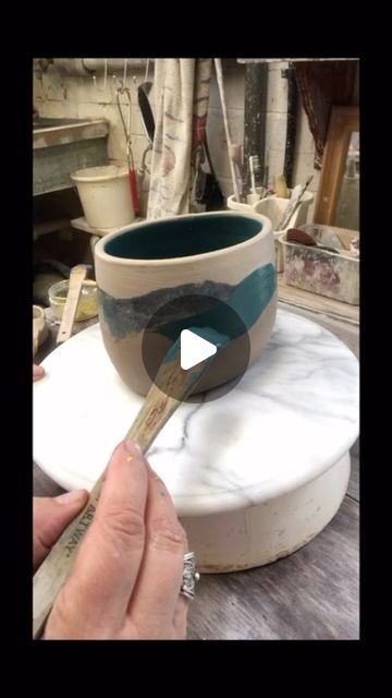 Marina Randall on Instagram: "Painting my vessels with clay (slips) is probably my favourite process of making these. I’m often inspired by places I’ve been to or scenes in my memory. I paint on to green ware and apply layers of vitreous slips using different techniques. Although the colours are carefully considered before applied as each one has to be mixed up to the right consistency first- the design and application is spontaneous. I like to capture an element of movement in the brushstroke.  After the layers of slip are dryer I may add more layers, scratch, sponge, scr#marinarandallceramics affito some areas before  the bisque firing . After that I may apply underglazes, resists and glazes.  Watch this space for final firing 😊🌻 #contemporaryart #ceramicart #studioceramics #thrownanda Clay Painting Techniques, Decorating With Slip Pottery, Painting Pottery Techniques, How To Use Underglaze, Slip Decorated Pottery, Slip Ceramics, Slip Design Ceramics, Slip Painting Ceramics, Ceramic Painting Techniques