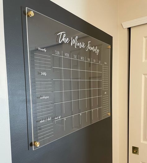 Family Calendar Wall Entryway, Home Wall Calendar Ideas, Acrylic Family Wall Planner, Family Planner Wall Kitchen, Acrylic Command Center Ideas, Family Acrylic Calendar, Black Wall Command Center, Chalk Wall Calendar Ideas, Mudroom Calendar Wall