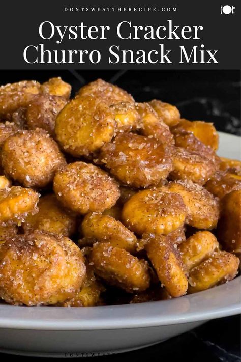 Cinnamon Churro Puppy Chow, Best Snacks For Parties, Churro Bites Oyster Crackers, Churro Oyster Crackers Recipe, Salty Summer Snacks, Cheap Snack Mix Recipes, Churro Oyster Crackers, Sweet And Salty Churro Bites 12 Tomatoes, Churro Snack Mix Recipes