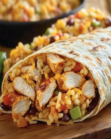 Taco Bell Chicken Burrito Recipe - Easy & Delicious Meal Rice Chicken Burritos, Taco Bell Chicken Burrito Recipe, Chicken Bean Rice Burrito, Cantina Chicken Burrito, Been Burrito Recipe, Burrito Chicken Recipe, Leftover Chicken Burritos, Burittos Bowl Recipes, Taco Bell Chicken Burrito