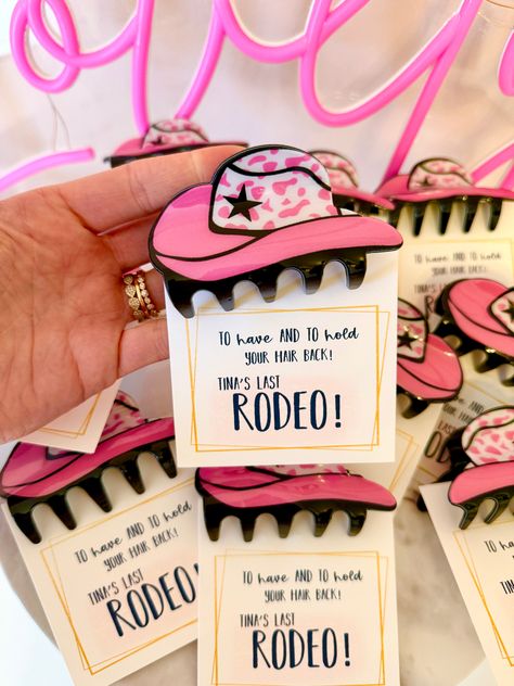 Bachelorette Party gift favor! I can personalize the cards to say anything you would like! Leave a message at check out with information.With your purchase you receive:1 Personalized CardPink Cowgirl Hat Claw Clip (acrylic)THE LOVE LEIGH GIFT PROMISE: Our goal is to hand make you a one of a kind memorable gift! We love what we do and want to share the love! Bachelorette Party Souvenirs, Last Rodeo Bachelorette Party Favors, Funny Bachelorette Decor, Bridal Shower Cowgirl Theme, The Last Hoedown Bachelorette, Cowboy Hens Party, Austin Tx Bachelorette Party Theme, Bachelorette Party Favor Ideas, Cowboy Theme Hen Party