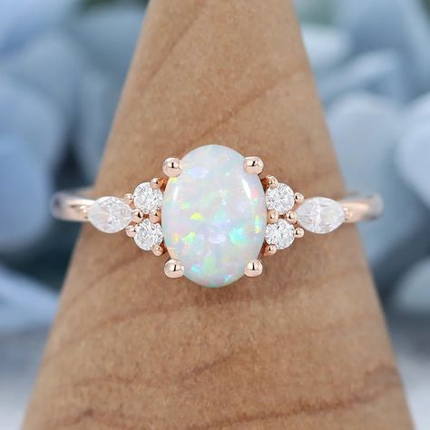 Dainty Natural White Opal Stack Diamond Ring, 14k Solid Gold October Birthstone Ring, Oval Cut Stacking Solitaire Vintage Opal Promise Ring ------------------------------------------------------------------------------------------------------- ITEM DESCRIPTION : ITEM : RING METAL : 925 STERLING SILVER PLATING : ROSE GOLD / GOLD / SILVER GEMSTONE : OPAL ORIGIN : ETHIOPIA CREATION : LAB CREATED SIZE : 6*8 MM COLOR : WHITE SHAPE : OVAL  BIRTHSTONE : OCTOBER FINISHING : SUPER FINE RING SIZE : US 3 T Opal Engagement Ring Vintage, Cluster Engagement Ring Vintage, Opal Engagement Ring Rose Gold, Opal Promise Ring, Vintage Opal Engagement Ring, Opal Engagement Ring Set, October Birthstone Ring, Rose Gold Engagement Ring Vintage, Unique Engagement Ring Settings