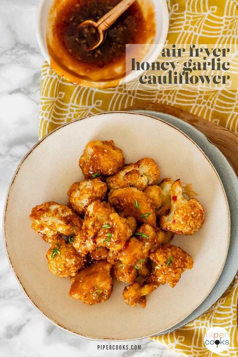 Craving something crunchy and delicious? This air fryer honey garlic cauliflower recipe is the answer. Crispy, flavorful cauliflower that's a breeze to make in the air fryer. Tossed in a sweet and savory honey garlic sauce, this dish is a veggie lover's dream. Perfect as a side or snack on game day, and quick enough for weeknight dinners, it's sure to be a hit with the whole family. Honey Garlic Cauliflower, Honey Cauliflower, How To Cook Cauliflower, Garlic Cauliflower, Cauliflower Wings, Honey Garlic Sauce, Cauliflower Recipe, Airfryer Recipes, Cauliflower Bites