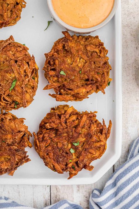 Overhead close up shot of a plate of sweet potato fritters with a dip. Potato Fritters Air Fryer, Fritters Air Fryer, Potato Fritters Recipe, Sweet Potato Fritters, Cheesy Hashbrowns, Spicy Dip, Crispy Hashbrowns, Kitchen Notes, Potato Fritters