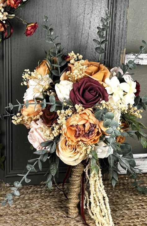 This beautiful bride bouquet is just the perfect blend of peach blush and ivory flowers to give it that soft and romantic fall Victorian feel.  Made with a real touch/look, it has faux flowers, wood sola flowers, dried flowers, pampas grass, and faux greenery.   Bleached wisteria vines hang at the bottom.    The stem is wrapped with thick jute twine.  The bouquet is a single-sided bouquet measuring 15" tall from tip to tip and 10" wide.  The matching headband is a standard adult sized adjustable Fall Inspired Wedding Bouquets, Muted Fall Wedding Flowers, Fall Bride Bouquets, Western Wedding Bouquets, Southern Wedding Flowers, Flower Bride Bouquet, Wooden Bouquet, Ivory Hydrangea, Haunted Wedding