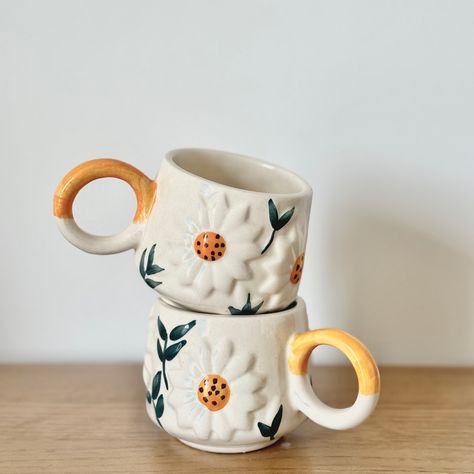 3D Daisy Cup Set (Available in Set of 2, Set of 4 and set of 6) Brighten up your tea time with your dear ones or your refreshing morning coffee with these modern yet artistic ceramic cup set. All the cups are handmade using some of the finest clays, that will enrich your serving experiences. Shop now WhatsApp +91-9779926125 for more details and order or email us at contactus@pankhhari.com . . . #homedecor #kitchenessentials #kitchencupset #teacupset #flowercupset #flowercup #teacups #s... Kitchen Cups, Flower Cup, Cup Set, Ceramic Cup, Tea Cup Set, Cupping Set, Ceramic Cups, 2 Set, Kitchen Essentials