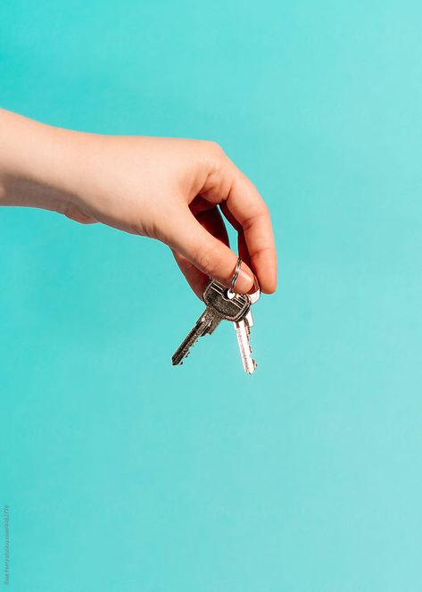 Hands holding keys to a house against a blue backdrop. Merch Shoot, Freedom Graphic, Blue Backdrop, Hand Reference, House Keys, Hands Holding, Blue Backdrops, Keys Art, Photoshoot Concept