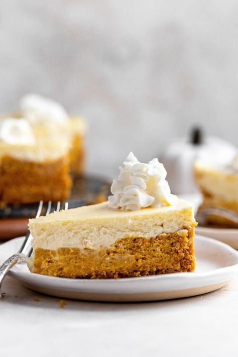 Double-Layer Pumpkin Cheesecake has one layer of creamy pumpkin and one regular cream cheese layer. Perfect for your Thanksgiving dessert! Double Layer Pumpkin Cheesecake, Eggnog Cheesecake Recipe, Holiday Cheesecake Recipes, Festive Dessert Recipes, Cheesecake Pie Recipes, Layered Pumpkin Cheesecake, Cheesecake Slice, Layer Cheesecake, Dinner Then Dessert