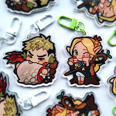 Delicious dungeon snacks are included with these keychains of Marcille and Laios! Details: Double-sided (different design on front and back). Good for a variety of things including keys, purses, bags, ita bags, lanyards, displays and more! Amazing gifts, too! Arrives with a free random vinyl sticker and an A6 thank-you print every time! Disclaimer: Colors may not appear the same in person as it does on your screen. Charms have a protective film on both sides, which we have not removed, but you may! There will also be a note reminding you of this in your package. Chibi Keychain Design, Anime Keyring, Delicious Dungeon, Genshin Impact Keychain, Genshin Acrylic Keychain, Dungeon Anime, Genshin Key Chain, Ita Bags, Dungeon Meshi