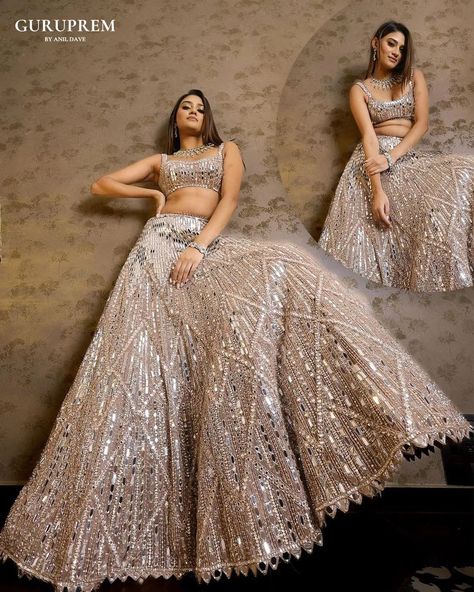 "Step into a world of ethereal beauty with this stunning silver shiny lehenga choli, a true testament to the artistry of ethnic fashion. The lehenga, adorned with exquisite embroidery, captures the light with its luminous sheen, creating a mesmerizing effect that is nothing short of magical. Each delicate stitch and intricate pattern is crafted with precision, reflecting a perfect blend of tradition and contemporary wear. Email : guruprem.socialmediateam@gmail.com Contact Us : +91 816978764... Shiny Lehenga, Global Wedding, Global Dress, Wedding Sutra, Wedding Lehenga, Ethereal Beauty, Bridal Inspiration, Unique Dresses, Bridal Portraits