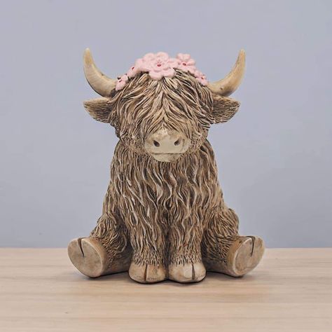 A cute resin Highland Cow ornament featuring pink flowers. Size 10cm x 8cm x 12cm PRE-ORDER - DUE IN END OF OCTOBER All orders containing pre-order items WONT BE POSTED OUT UNTIL ALL ITEMS ARE IN STOCK. Ceramic Animal Ideas, Highland Cow Sculpture, Ceramic Highland Cow, Highland Cow Clay Sculpture, Pottery Ornament Ideas, Cute Animals Clay, Animal Ceramics Ideas, Cow Ceramics, Highland Cow Clay