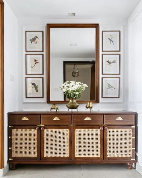 Temple Town shared a post on Instagram: "A cane and wood chest in the foyer occupies the pride of place in the foyer with a vintage mirror and beautiful botanicals. #templetowninteriors #templetownfurniture #homes#decor #interior #design #designer #luxury #elledecor #classic". Follow their account to see 354 posts. Cane Cabinet, Crockery Unit, Homes Decor, Living Room Tv Unit Designs, Living Room Tv Unit, Indian Home Interior, Colonial Style Homes, Cupboard Design, Wood Chest