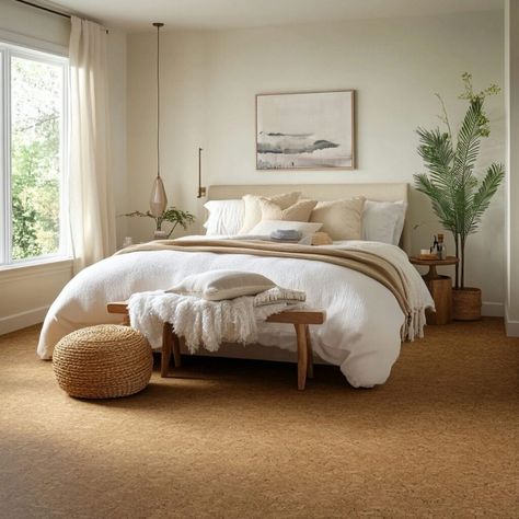 This inviting bedroom features eco-friendly cork flooring, adding warmth and a natural touch to the space. Cork, a renewable building material, offers comfort, sound absorption, and durability, perfect for creating a serene, environmentally conscious atmosphere. Paired with neutral decor and natural textures, this cork floor enhances the room’s cozy aesthetic, ideal for those seeking sustainable, stylish home interiors. Cork Floor Bedroom, Cork Flooring Bedroom, Carpet Flooring Bedroom, Carpet Floor Bedroom, Building Materials Architecture, Flooring Bedroom, Natural Cork Flooring, Cork Floor, Cozy Bedroom Design