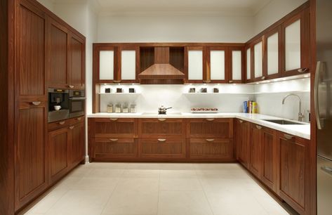 The cabinets are found above and below the countertops across modern kitchens in Pakistan. They are usually separate structures and offer sufficient space to store all kinds of kitchen utensils, equipment and the uncooked food items. Hiasan Dalaman Dapur, Dapur Moden, Walnut Kitchen Cabinets, Cabinet Door Designs, Modern Wood Kitchen, Wooden Kitchen Cabinets, Contemporary Kitchen Cabinets, Fancy Kitchens, Walnut Kitchen