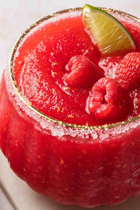 This frozen raspberry margarita recipe is the best frozen summer indulgence. With raspberry flavors that mingle perfectly with the crispness of the tequila and tart lime juice, these easy-to-make icy margarita come together in just a few minutes. Frozen Raspberry Margarita, Raspberry Margarita Recipe, Tequila And Lemonade, Frozen Watermelon Margarita, Raspberry Margarita, Raspberry Drink, Margarita On The Rocks, Frozen Summer, Perfect Margarita