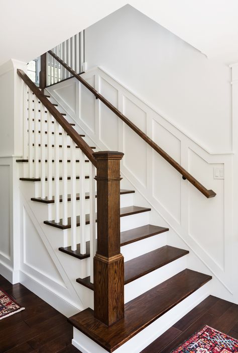 Oakwood Residence | Main Staircase | Z+ Interiors Stairs Wall Design, Wood Railings For Stairs, Classic Staircase, Farmhouse Stairs, Transitional Staircase, Stairs Wall, Interior Stair Railing, Stairs Renovation, White Staircase