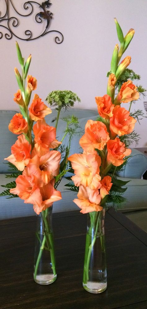 Love these orange gladiolus with queen's anne lace for centerpieces Gladiolus Flower Arrangements Wedding, Flower Arrangements With Gladiolus, Gladiolus Wedding Centerpiece, August Wedding Flowers Centerpieces, Gladiolus Arrangements Vase, Gladiola Centerpiece, Gladioli Flower Arrangements, Gladiola Bouquet, Gladiolus Bridal Bouquet