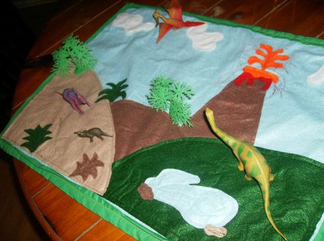 So, I am really excited to share this with you all today!  EEK!  Without further ado... the Dino Felt Play Mat! I got the idea here but w... Tela, Sewing Gifts For Boys, Dinosaur Play Mat, Boy Sewing Projects, Homemade Kids Gifts, Diy Dinosaur, Felt Play Mat, Dinosaur Play, Boy Sewing