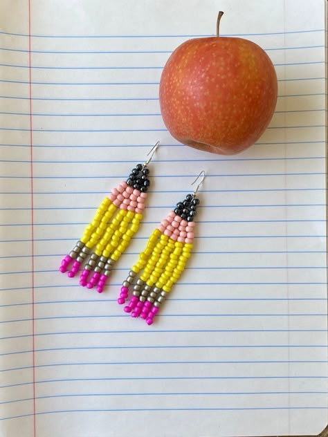 These earrings are the perfect fit for any teacher's outfit! This pair varies slightly from the other Pencil Beaded Earrings due to larger bead size & longer length. (approx 3 inches) All earrings are handmade and therefore each pair is slightly different and unique.  Custom color request? Message me! Pencil Earrings Diy, Beaded Pencil Earrings, Teacher Beaded Earrings, How To Beaded Earrings, Seed Bead Jewelry Tutorials, Earring Inspired, Pencil Earrings, Seed Bead Projects, Native American Beadwork Patterns