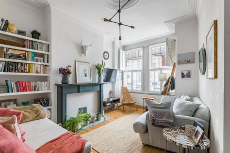 Small London Flat, London Flat Interior, Shed Apartment, Blue Fireplace, Small Flats, Condo Inspiration, Lavender Walls, Wood Lounge Chair, Bookshelves In Living Room