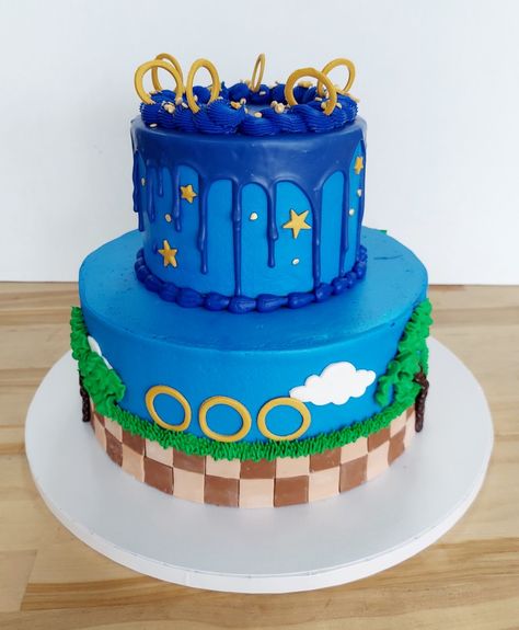 Sonic the Hedgehog themed cake iced in buttercream with fondant design details. *Add store bought figurines at the party so they don't topple over during transportation. #sonicthehedgehog #sonic #customcakes #kids cakes #cakeideas #americandreamcakes #jacksonvillenc Sonic The Hedgehog Theme Party, Sonic The Hedgehog Cake Buttercream, Sonic Drip Cake, Sonic Buttercream Cake, Sonic The Hedgehog Birthday Party Cake, Sonic The Hedgehog Cupcakes, Sonic The Hedgehog Birthday Cake, Golden Sonic, Sonic Ice Cream