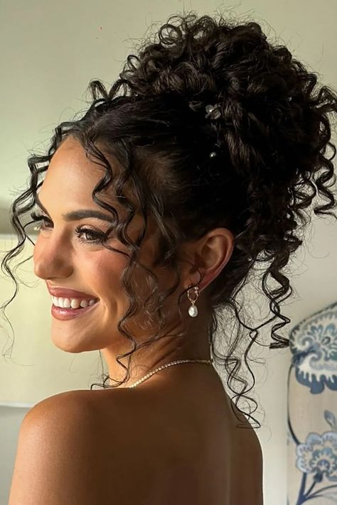 20 curly hair updos ideas you will love 3 Curly Upstyles For Long Hair, Up Due Hairstyles For Curly Hair, Hoco Hairstyles Updo Curly Hair, Cute Easy Updos For Curly Hair, Curly Bun Updo Prom, Hairstyles For Curly Hair For A Wedding, Simple Elegant Curly Hairstyles, Classy Bun Wedding Hair, Brown Curly Wedding Hair